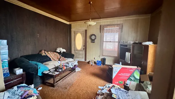 a bedroom with bed and a window