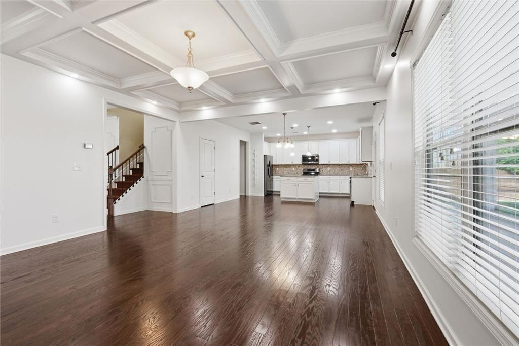 2495 Matlin Way Buford, GA 30519 - Photo 11 of 36 a view of a hallway with wooden floor