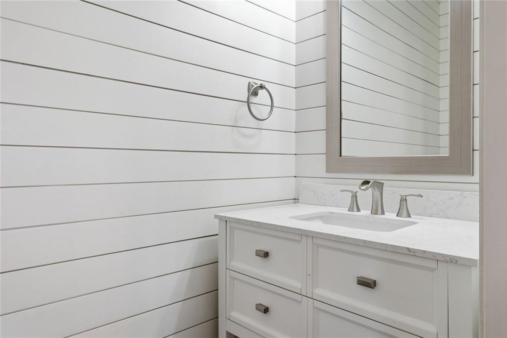 2495 Matlin Way Buford, GA 30519 - Photo 18 of 36 a bathroom with a sink and vanity