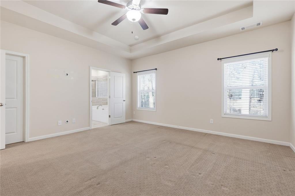 2495 Matlin Way Buford, GA 30519 - Photo 21 of 36 a view of an empty room with a window