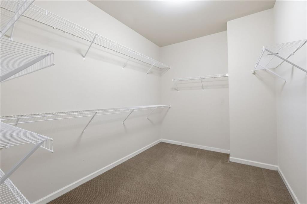 2495 Matlin Way Buford, GA 30519 - Photo 25 of 36 a view of a room with racks on the wall