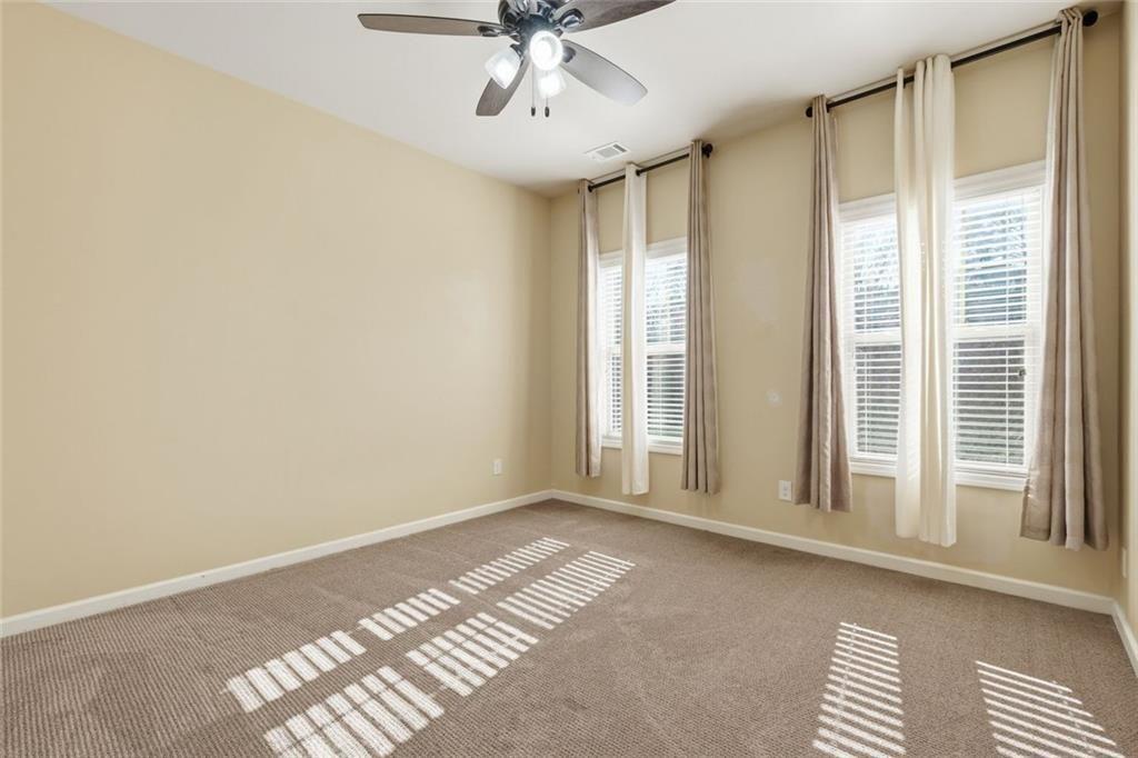 2495 Matlin Way Buford, GA 30519 - Photo 28 of 36 a view of an empty room with a window