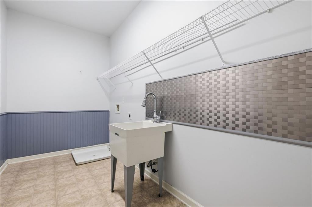 2495 Matlin Way Buford, GA 30519 - Photo 33 of 36 a utility room with dryer and washer
