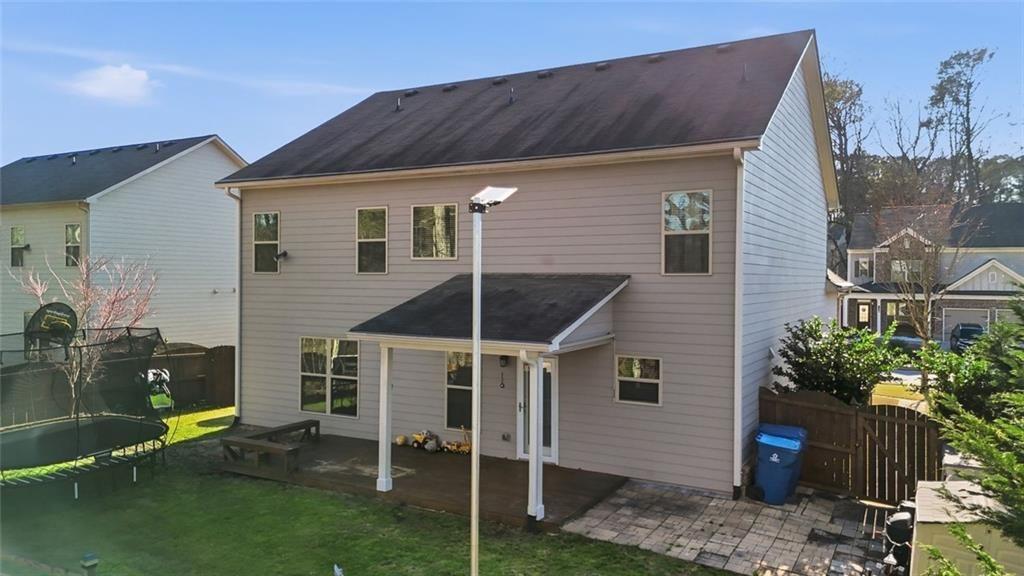 2495 Matlin Way Buford, GA 30519 - Photo 35 of 36 a view of a house with backyard and a chair