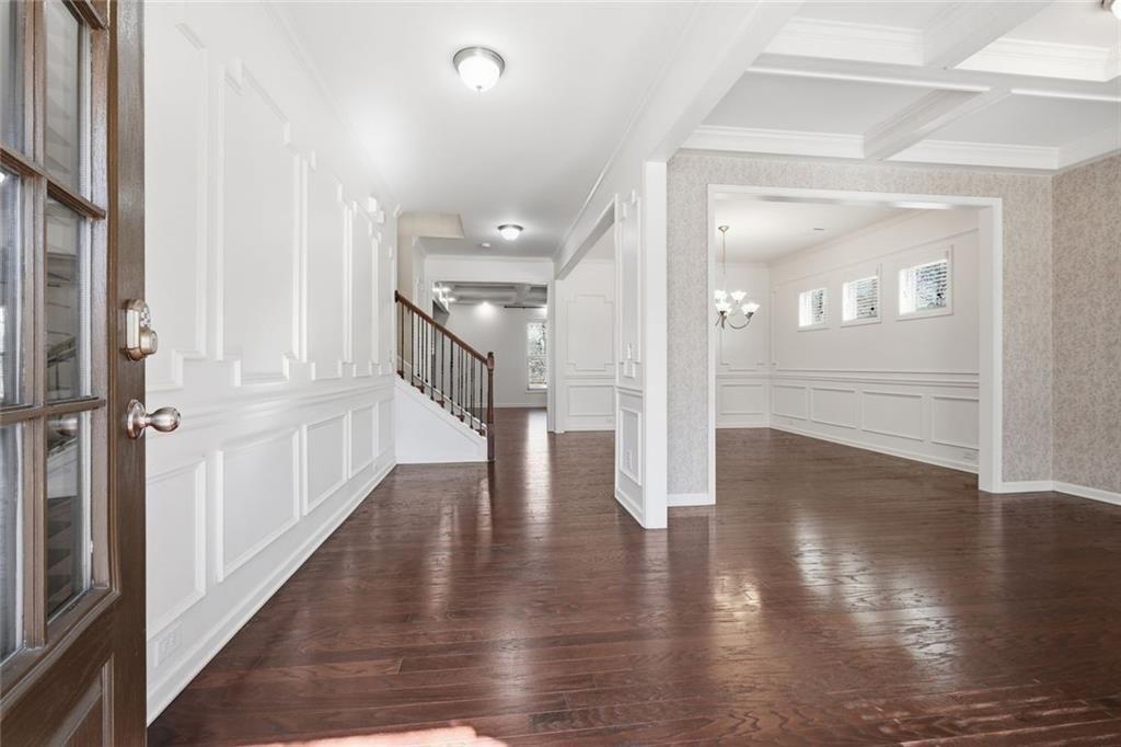 2495 Matlin Way Buford, GA 30519 - Photo 4 of 36 a view of a hallway with wooden floor