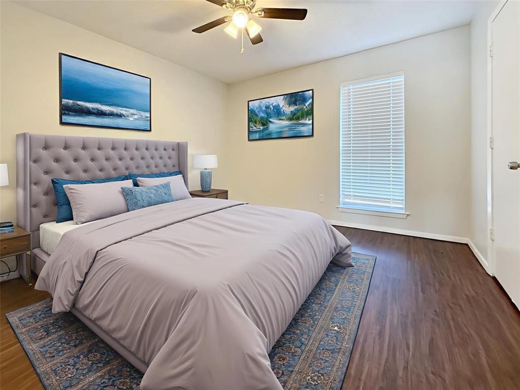 425 Southwest Thomas Street, Unit B Burleson, TX 76028 - Photo 14 of 22 a bedroom with bed and night stand