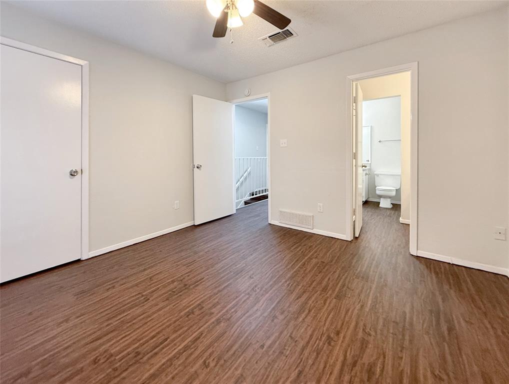 425 Southwest Thomas Street, Unit B Burleson, TX 76028 - Photo 15 of 22 wooden floor in an empty room with a window