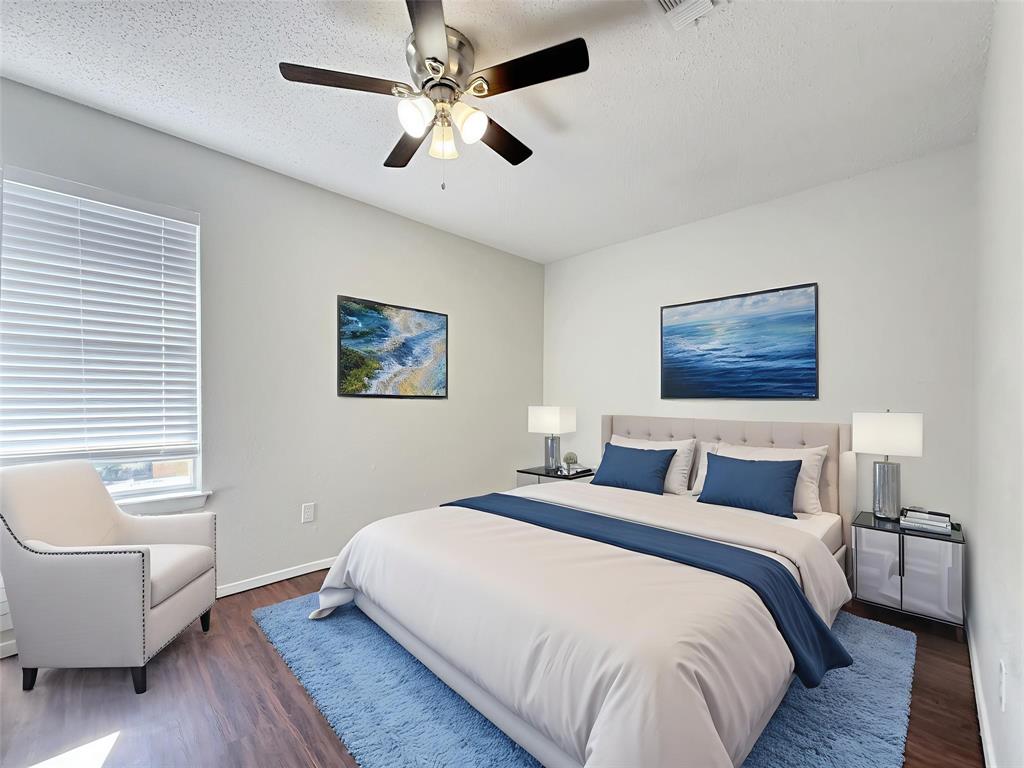 425 Southwest Thomas Street, Unit B Burleson, TX 76028 - Photo 20 of 22 a bedroom with a large bed a couch and a couch