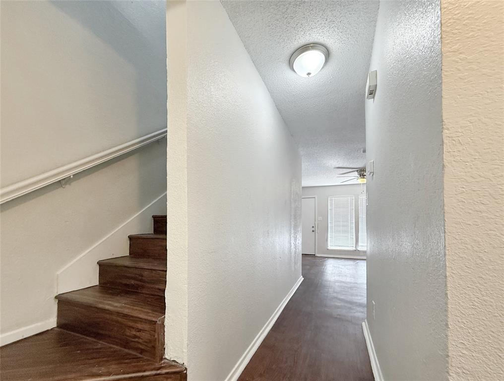 425 Southwest Thomas Street, Unit B Burleson, TX 76028 - Photo 10 of 22 a view of entryway with wooden floor