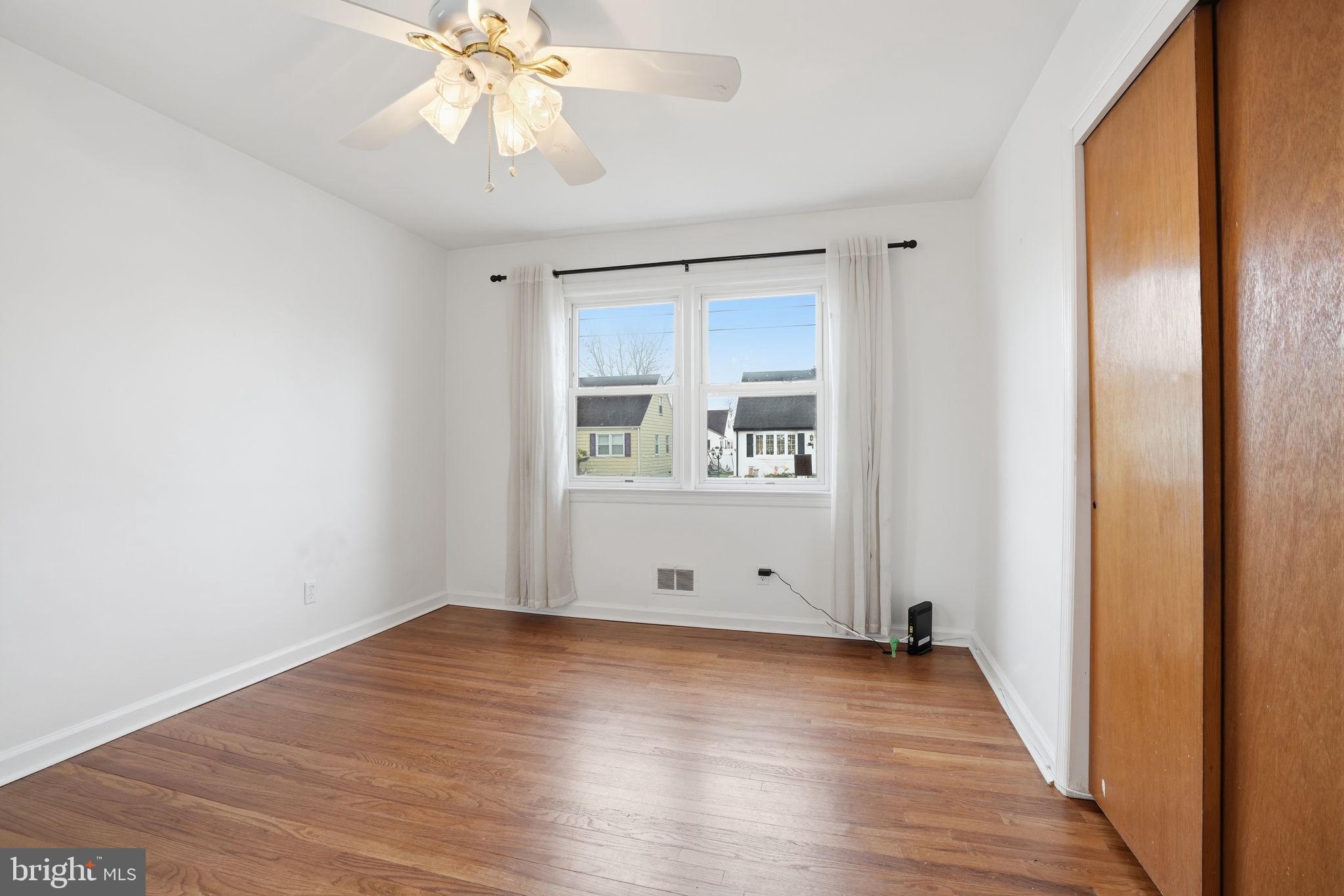 51 Unwin Drive Hamilton, NJ 08610 - Photo 18 of 32 a view of room with wooden floor and window