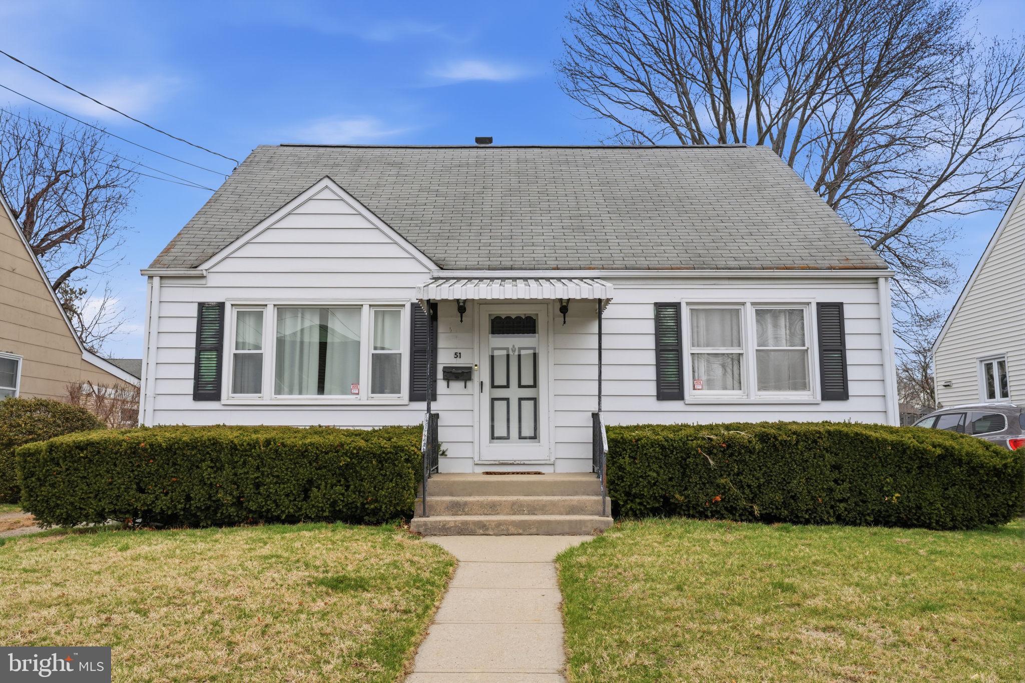 51 Unwin Drive Hamilton, NJ 08610 - Photo 2 of 32 a front view of a house with garden