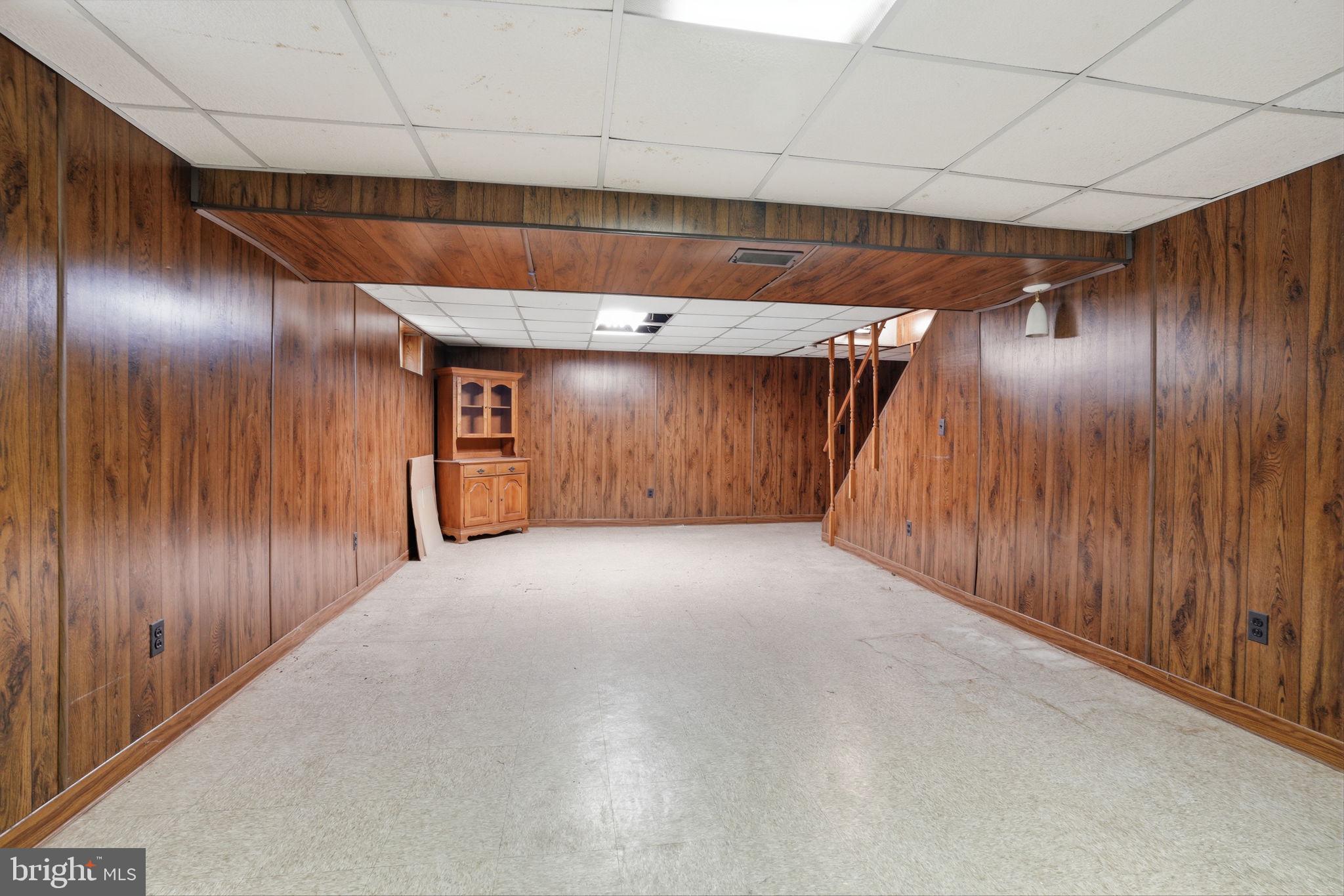 51 Unwin Drive Hamilton, NJ 08610 - Photo 29 of 32 a view of empty room with wooden walls