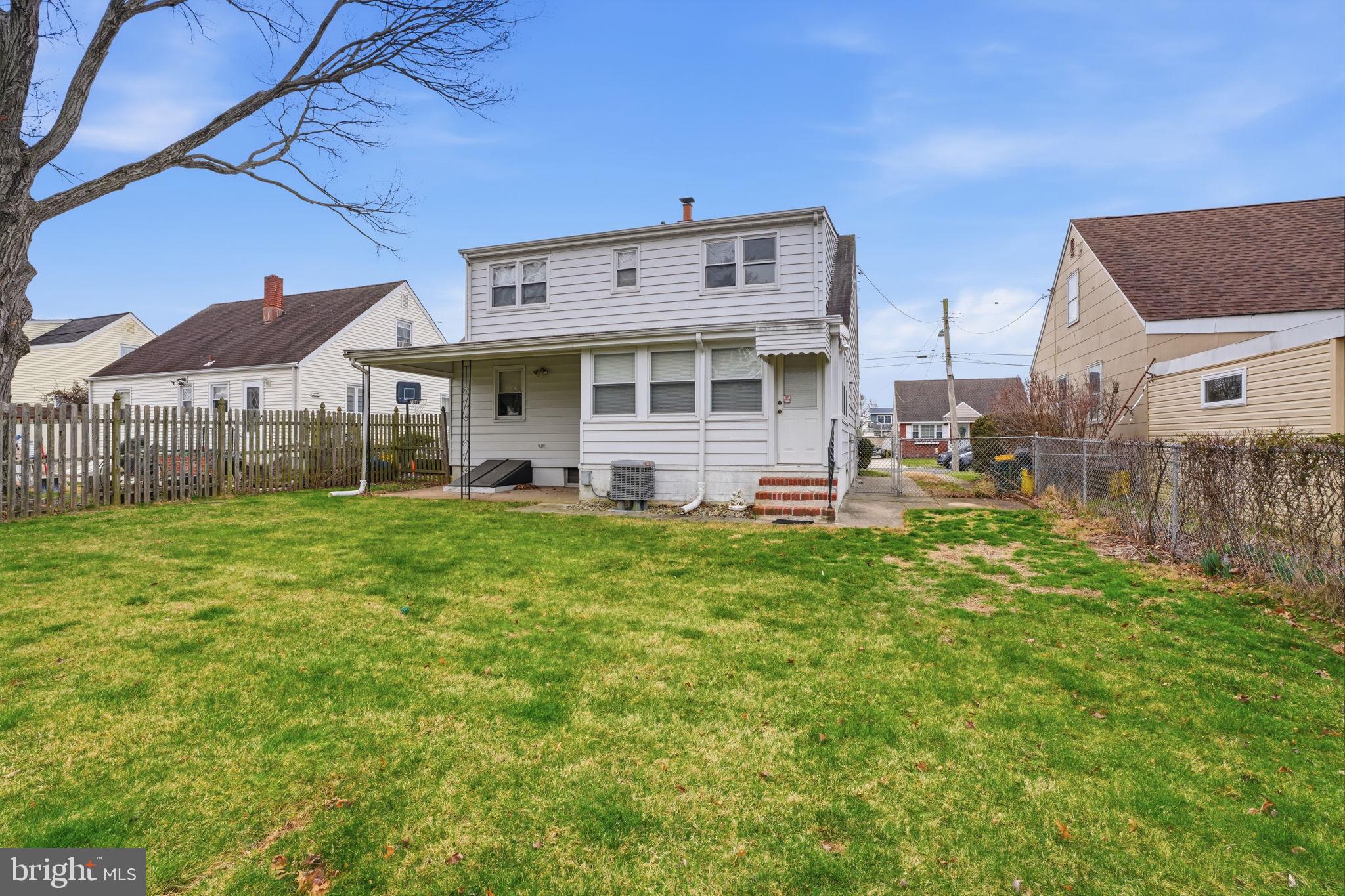 51 Unwin Drive Hamilton, NJ 08610 - Photo 6 of 32 a front view of a house with a garden