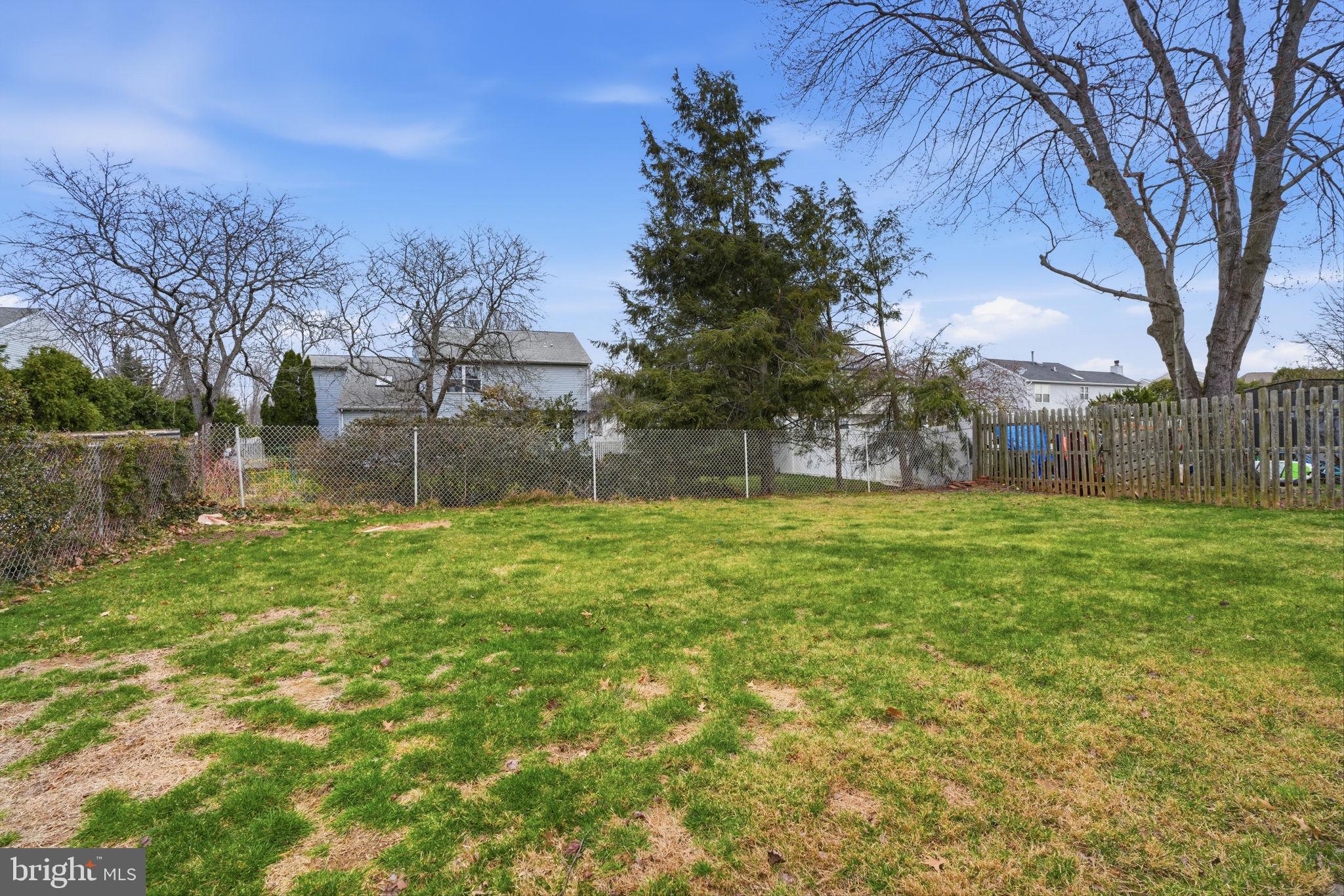 51 Unwin Drive Hamilton, NJ 08610 - Photo 9 of 32 a view of backyard with tree