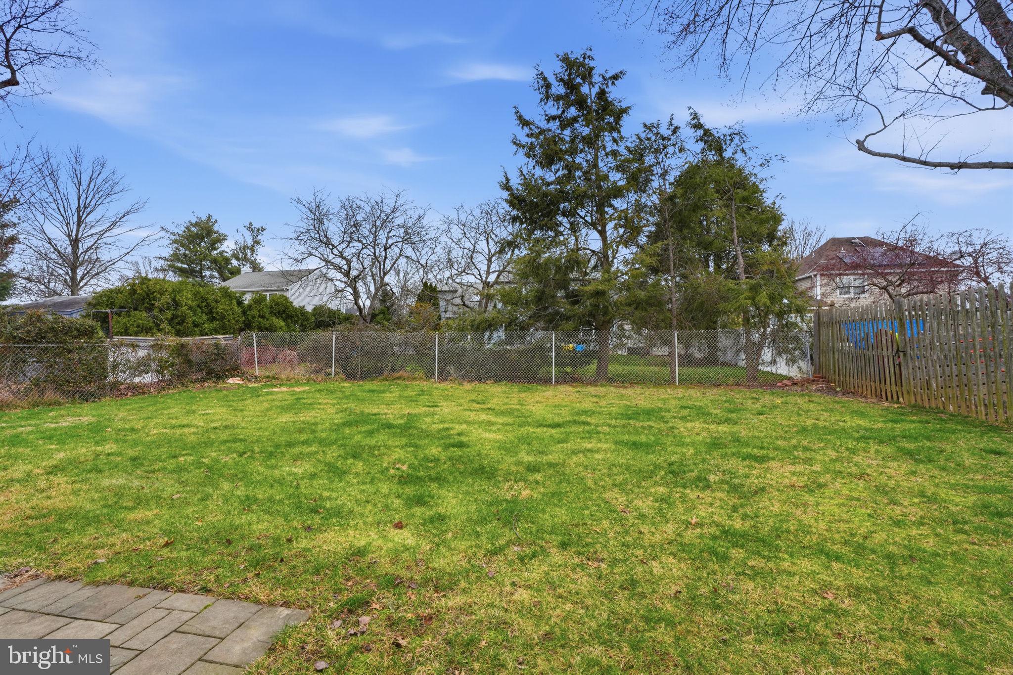 51 Unwin Drive Hamilton, NJ 08610 - Photo 10 of 32 a view of a yard with a tree