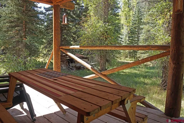 a outdoor dining space with furniture and outdoor view