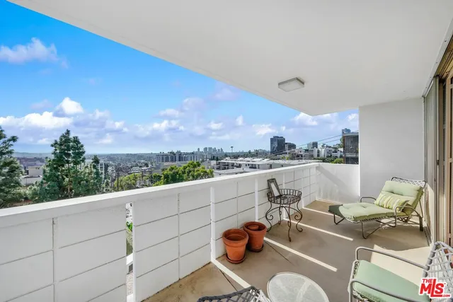 a view of roof deck with furniture