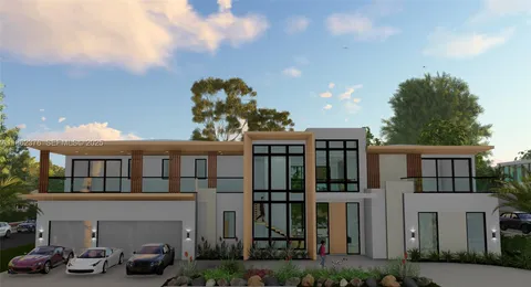 a very nice looking house with potted plants in front of it