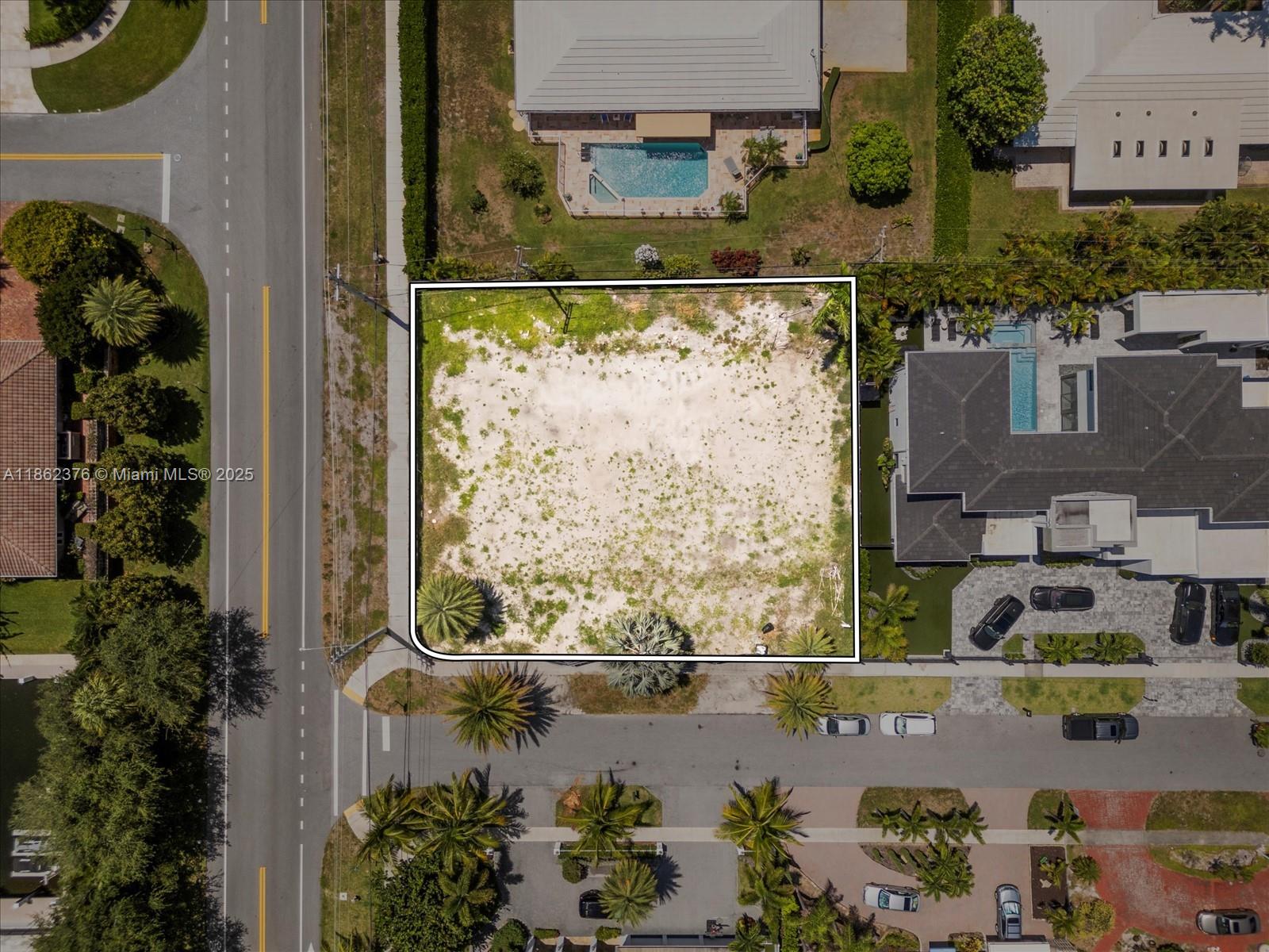 498 Northeast 10th Street Boca Raton, FL 33432 - Photo 5 of 9 an aerial view of a house with a yard