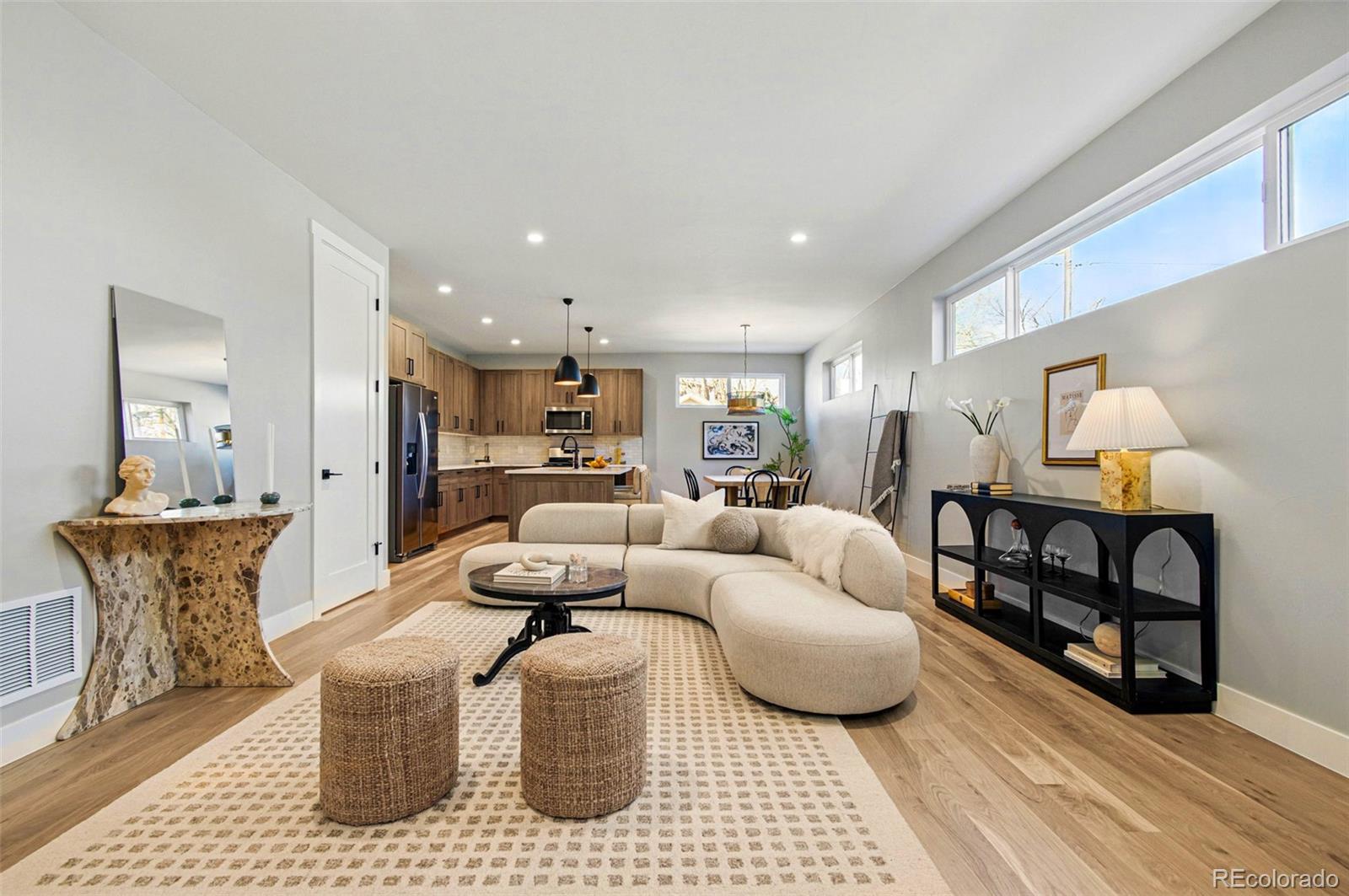 4121 Tejon Street Denver, CO 80211 - Photo 15 of 38 a living room with furniture a rug and white walls