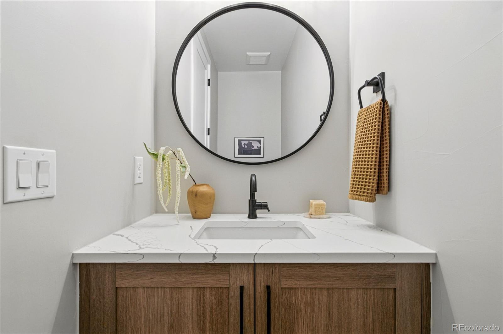 4121 Tejon Street Denver, CO 80211 - Photo 19 of 38 a bathroom with a sink and a mirror