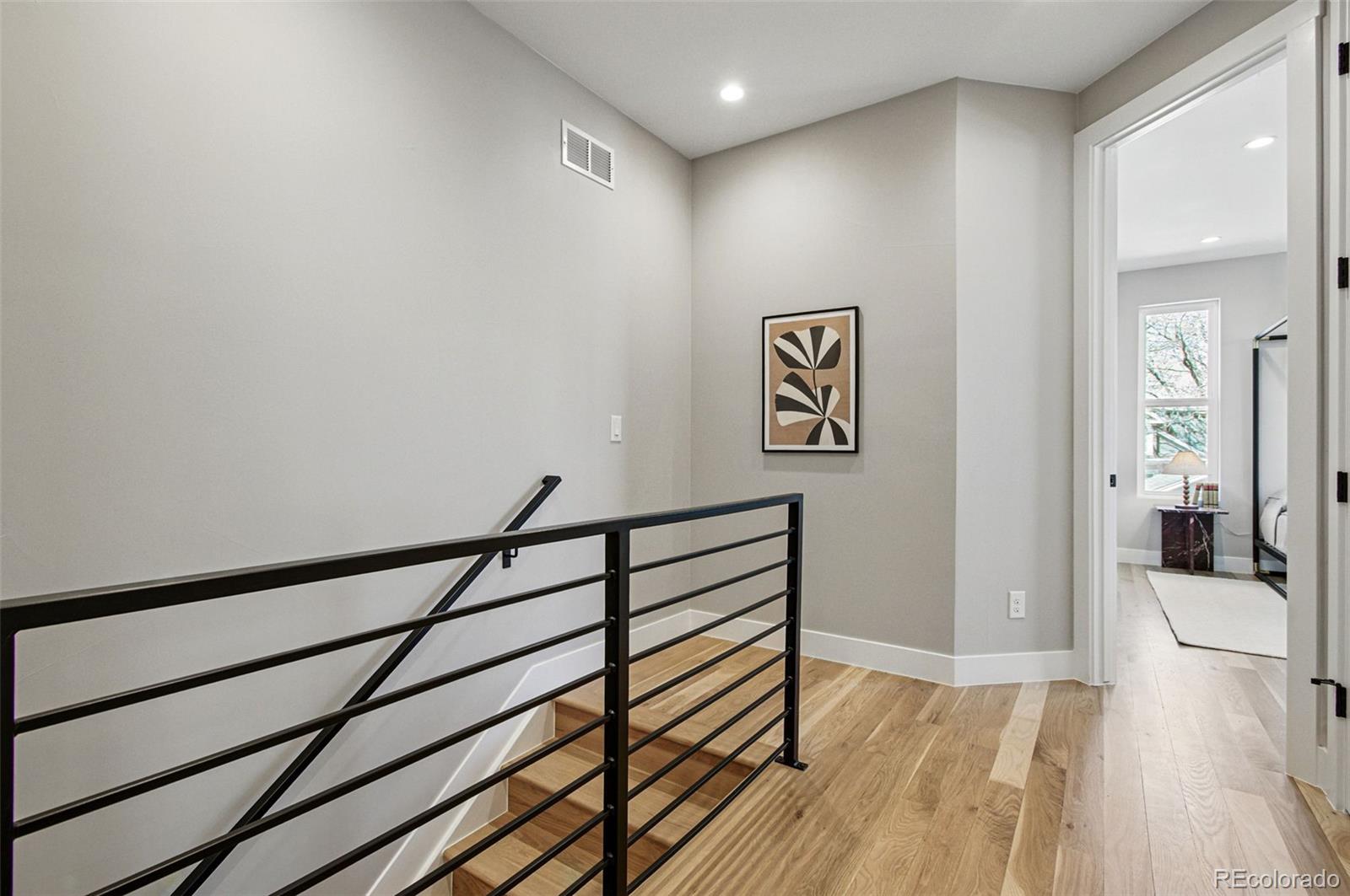 4121 Tejon Street Denver, CO 80211 - Photo 20 of 38 a view of a hallway with wooden floor