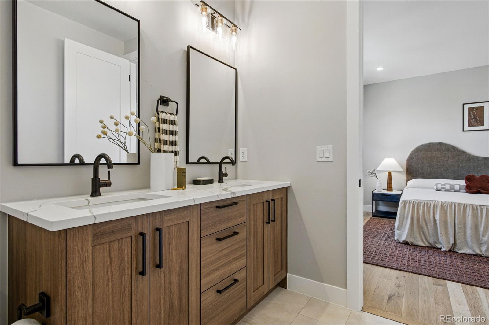 4121 Tejon Street Denver, CO 80211 - Photo 24 of 38 a en suite bathroom with a sink and a mirror