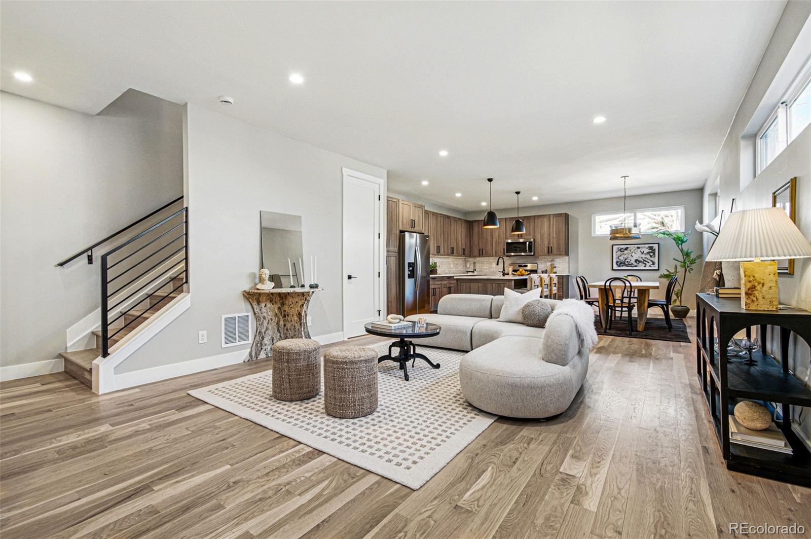 4121 Tejon Street Denver, CO 80211 - Photo 6 of 38 a living room with furniture and a wooden floor