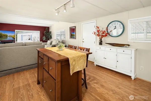 a view of a dining room with furniture window and wooden floor
