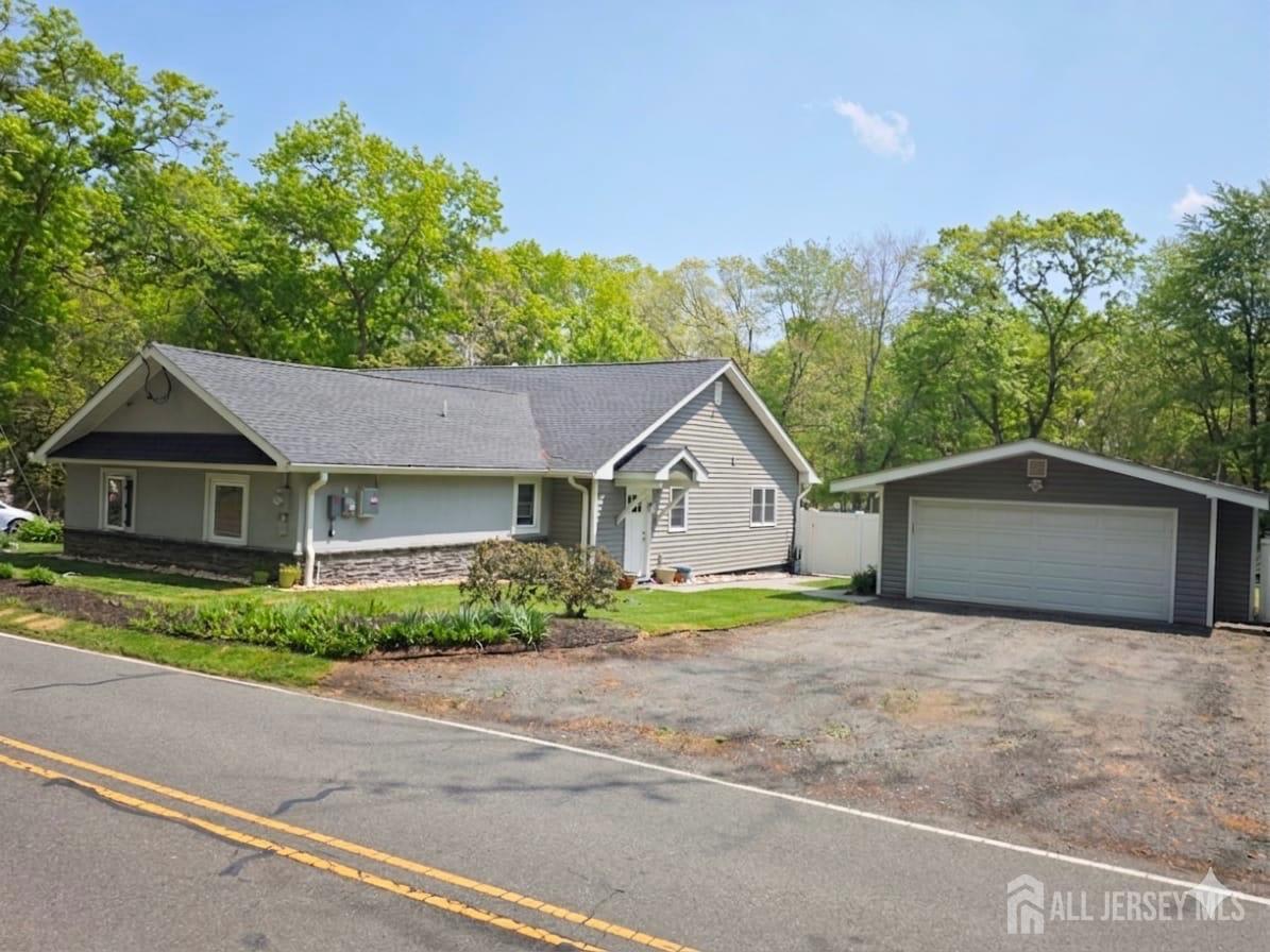 566 Ticetown Road Old Bridge, NJ 08857 - Photo 21 of 23 a house with trees in the background