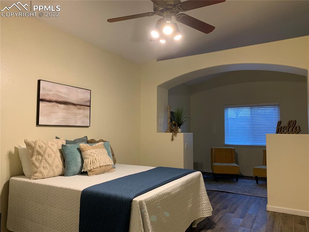 924 Samuel Point Colorado Springs, CO 80906 - Photo 15 of 22 a bedroom with furniture and a lamp