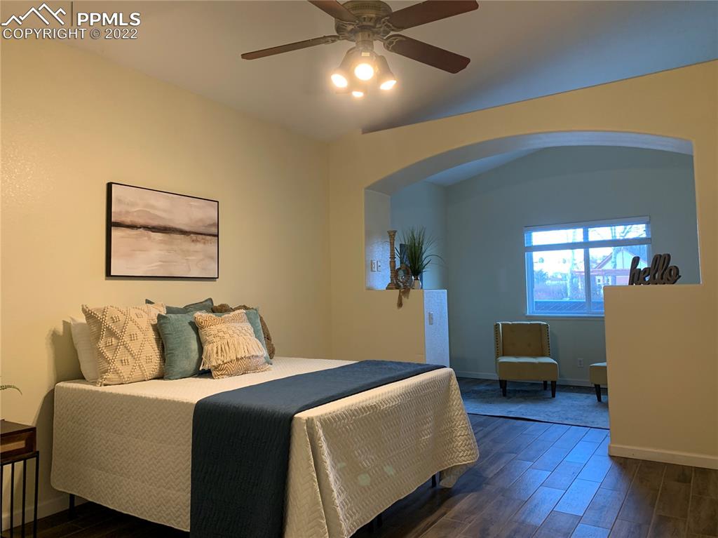 924 Samuel Point Colorado Springs, CO 80906 - Photo 6 of 22 a bedroom with a bed and a couch