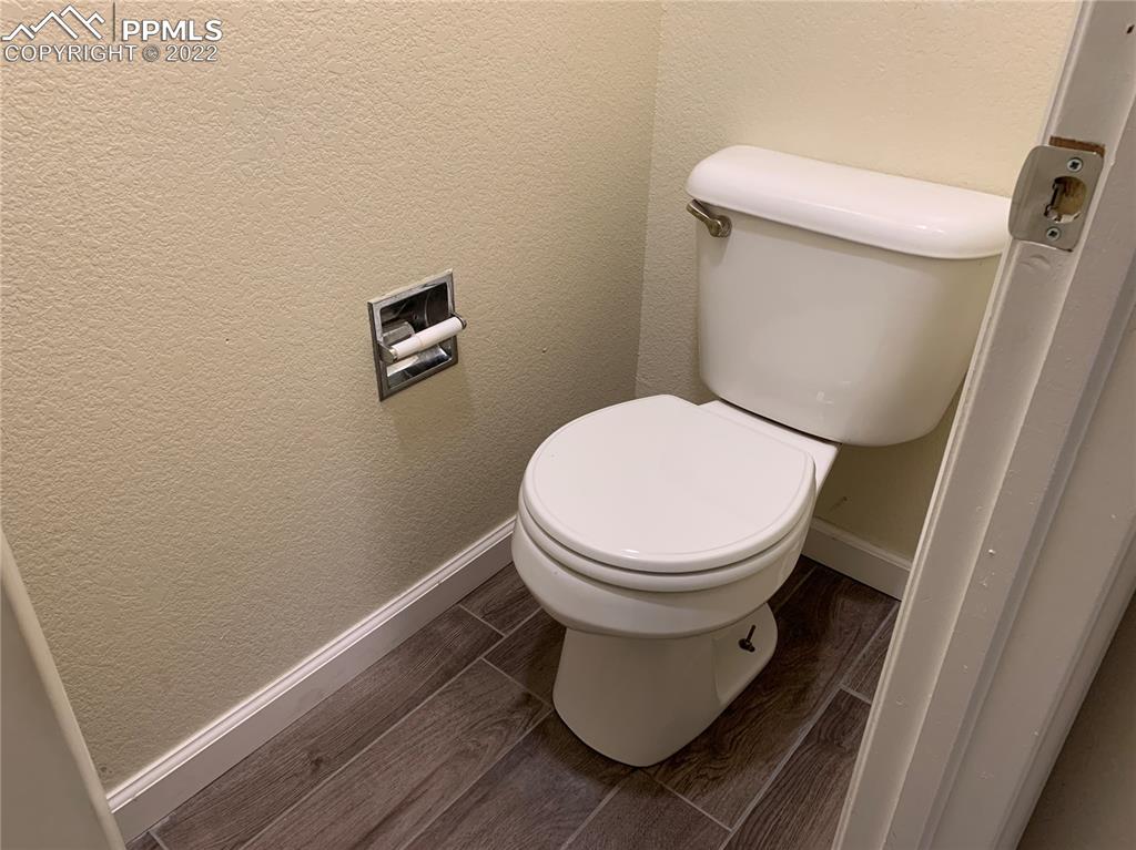 924 Samuel Point Colorado Springs, CO 80906 - Photo 8 of 22 a close view of a toilet in a bathroom