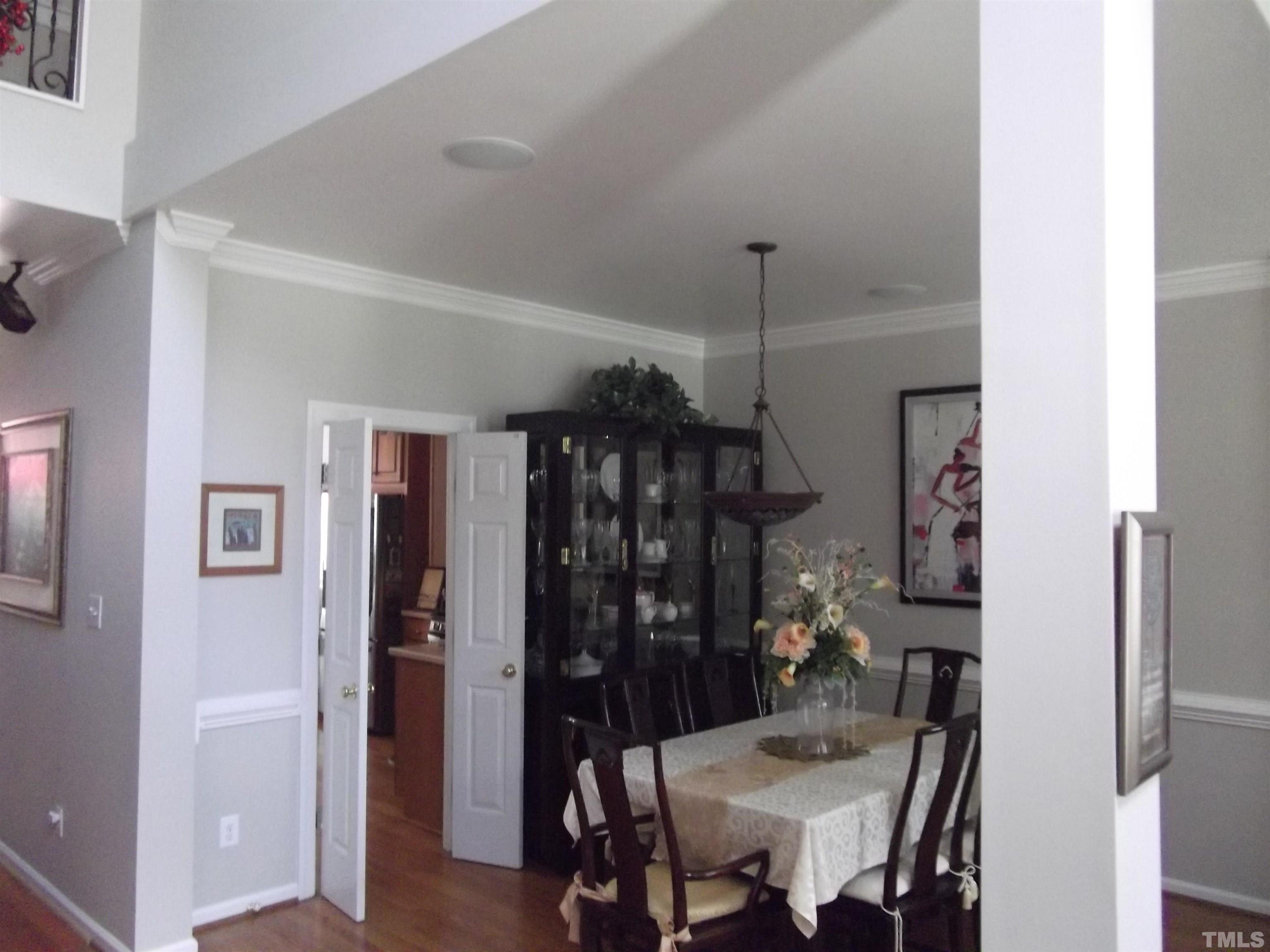 7912 Milltrace Run Raleigh, NC 27615 - Photo 11 of 36 a view of a dining room with furniture and chandelier