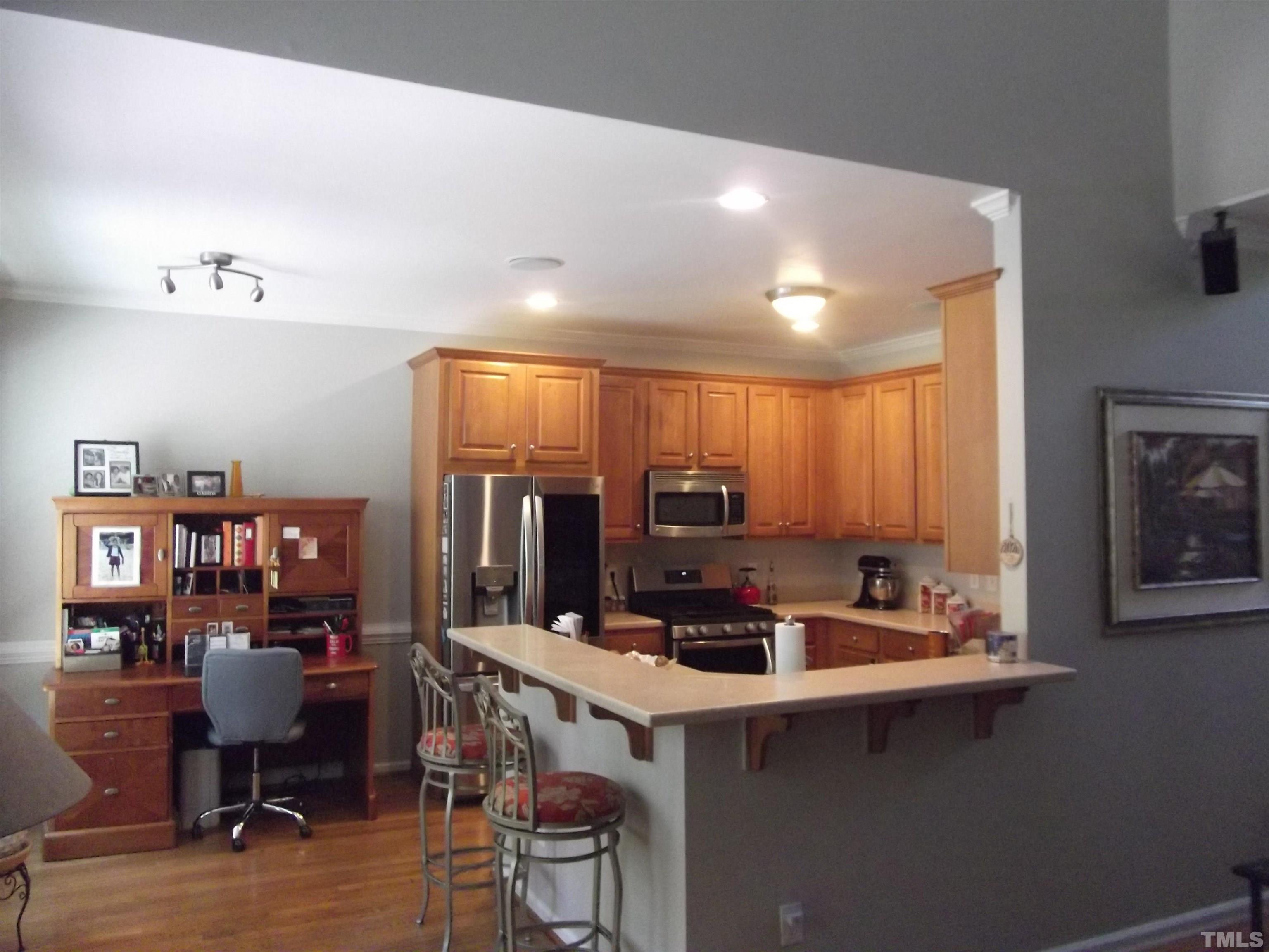7912 Milltrace Run Raleigh, NC 27615 - Photo 15 of 36 a kitchen with a sink cabinets and window