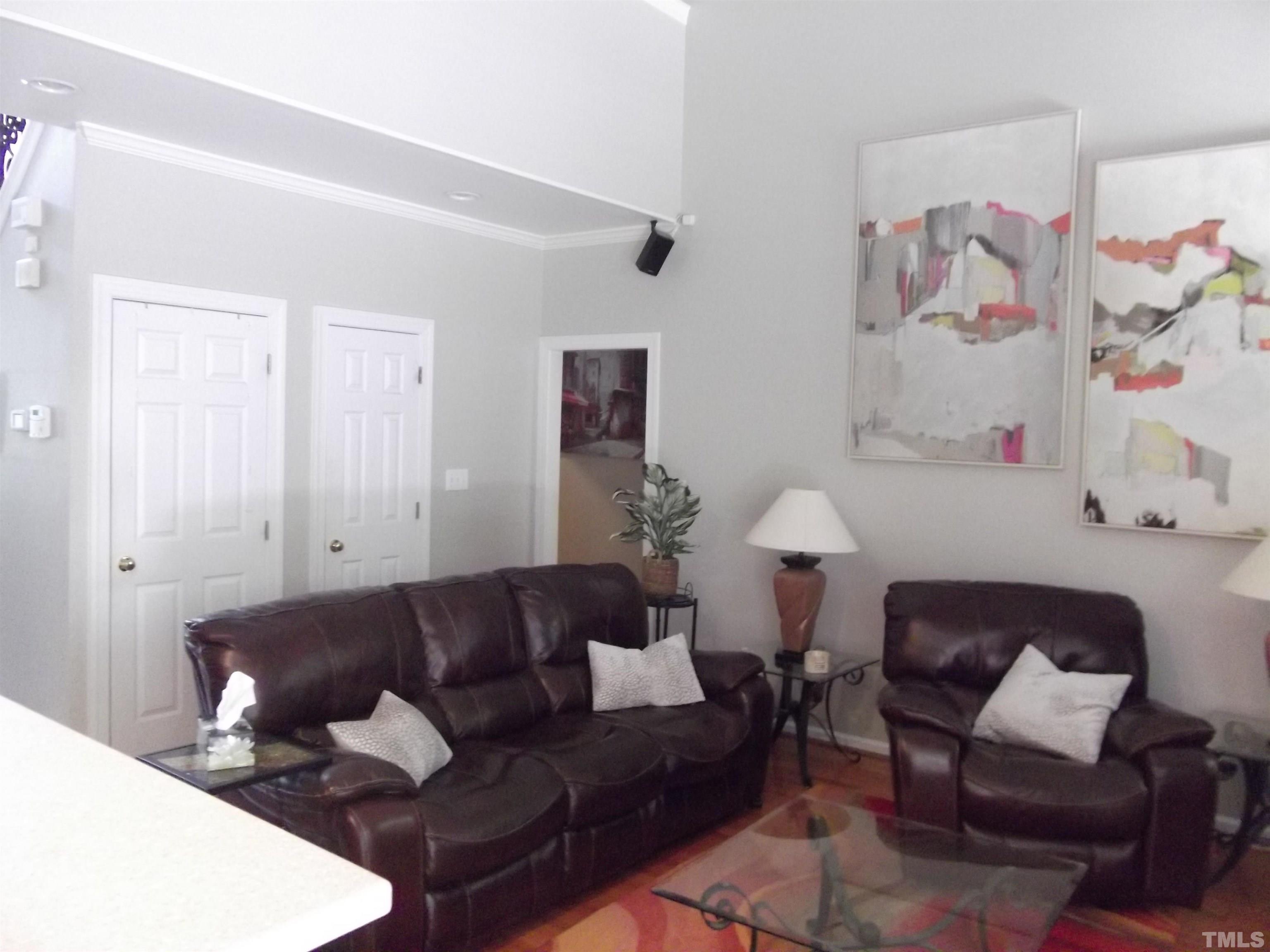7912 Milltrace Run Raleigh, NC 27615 - Photo 19 of 36 a living room with furniture and a couch
