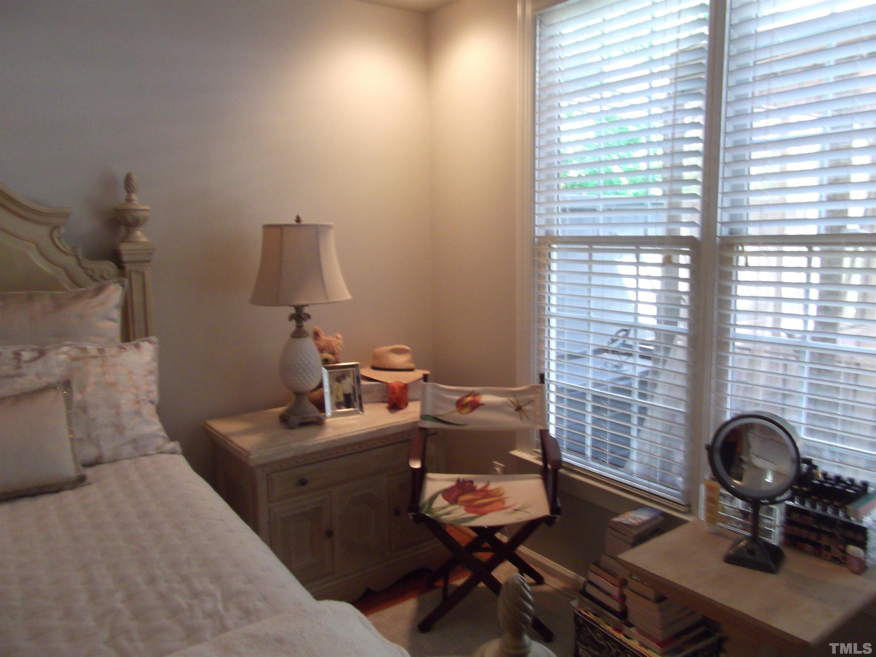 7912 Milltrace Run Raleigh, NC 27615 - Photo 21 of 36 a living room with furniture and a fireplace