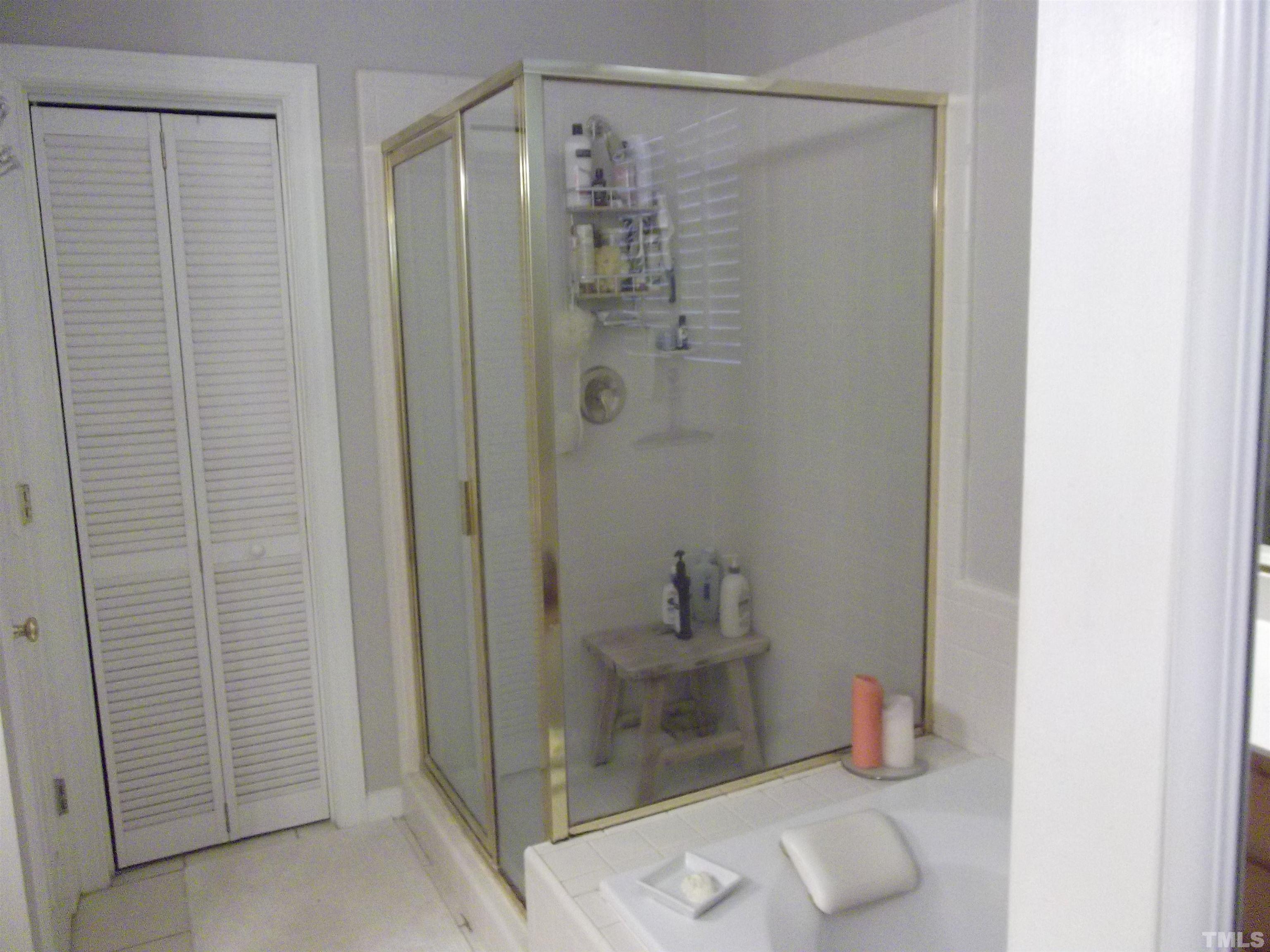 7912 Milltrace Run Raleigh, NC 27615 - Photo 25 of 36 a bathroom with a shower