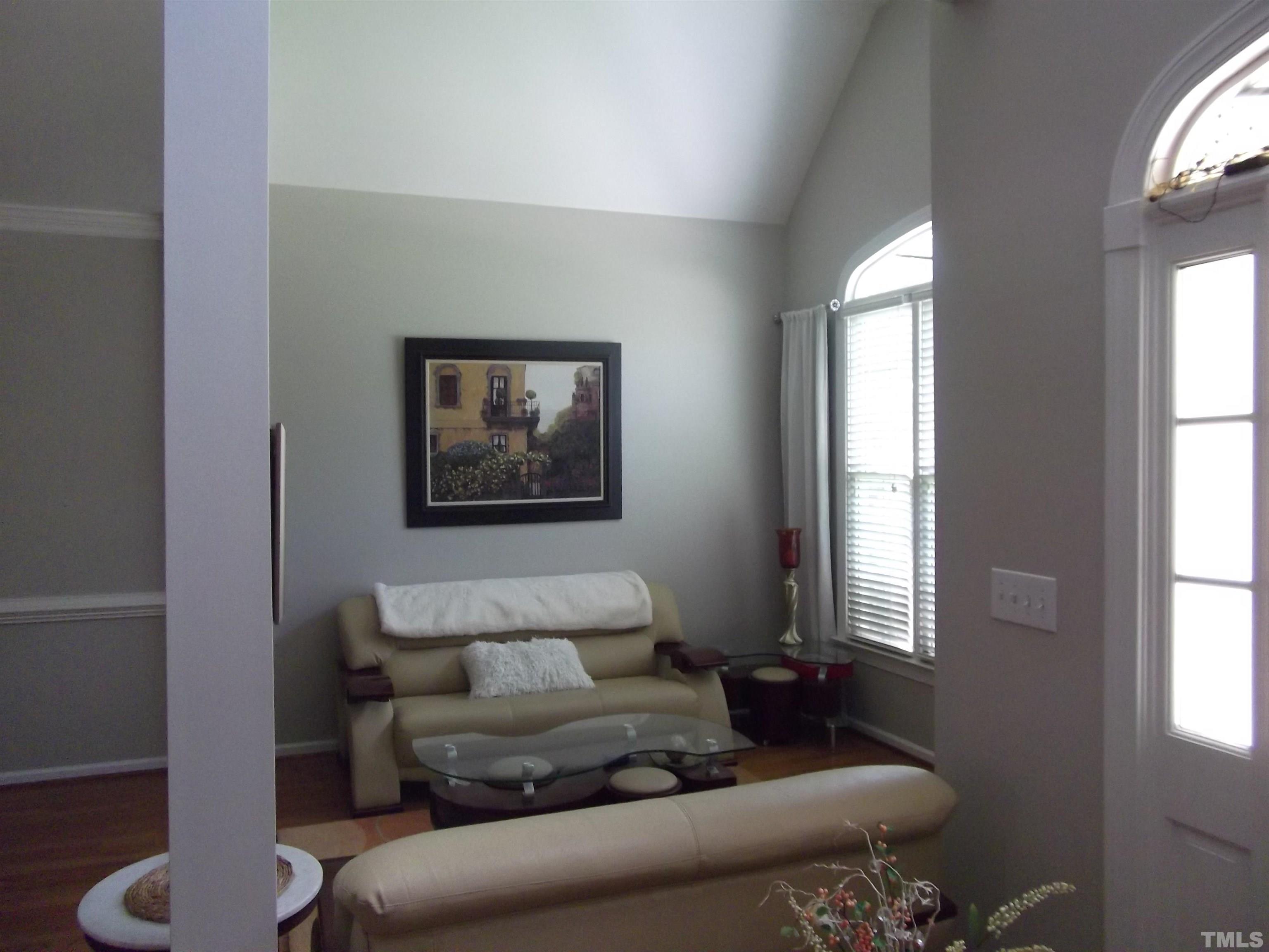 7912 Milltrace Run Raleigh, NC 27615 - Photo 5 of 36 a living room with furniture and a window
