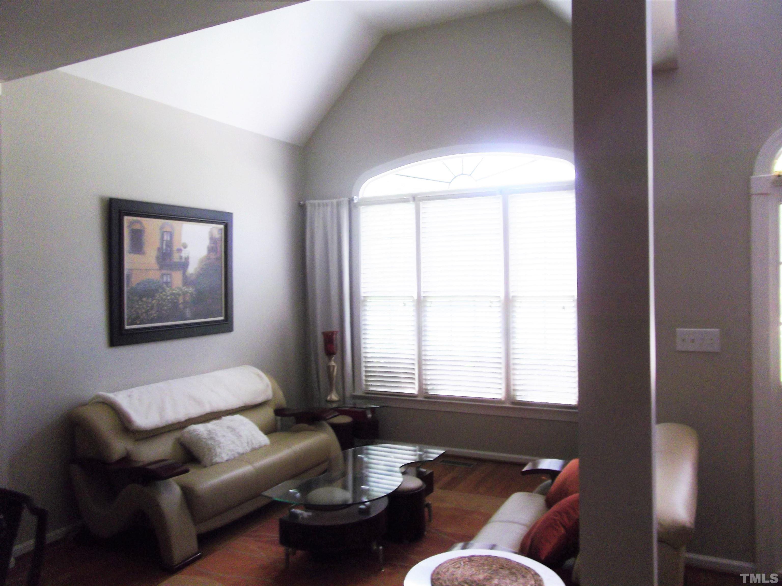 7912 Milltrace Run Raleigh, NC 27615 - Photo 6 of 36 a living room with furniture and a window