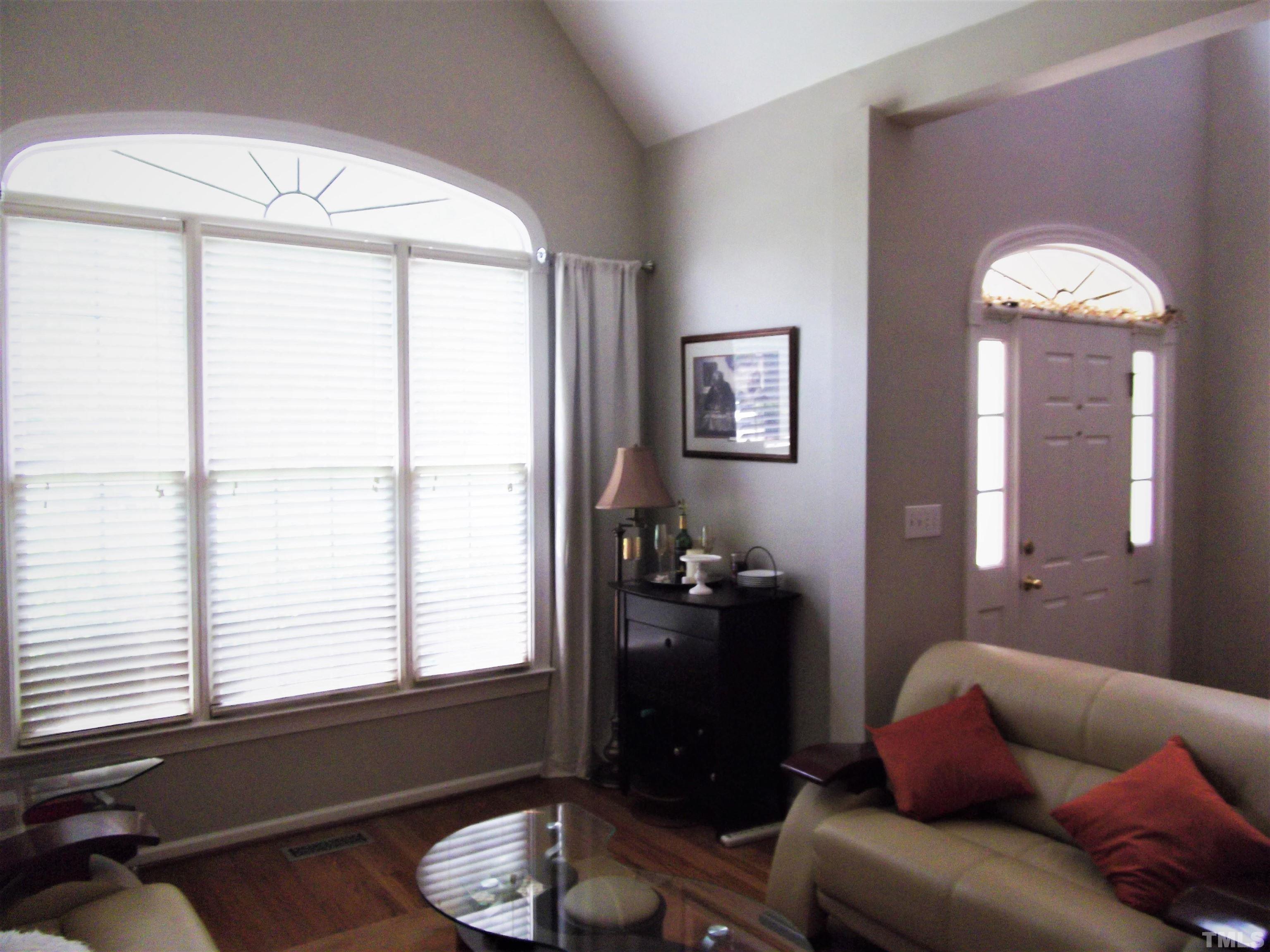 7912 Milltrace Run Raleigh, NC 27615 - Photo 7 of 36 a living room with furniture and a window