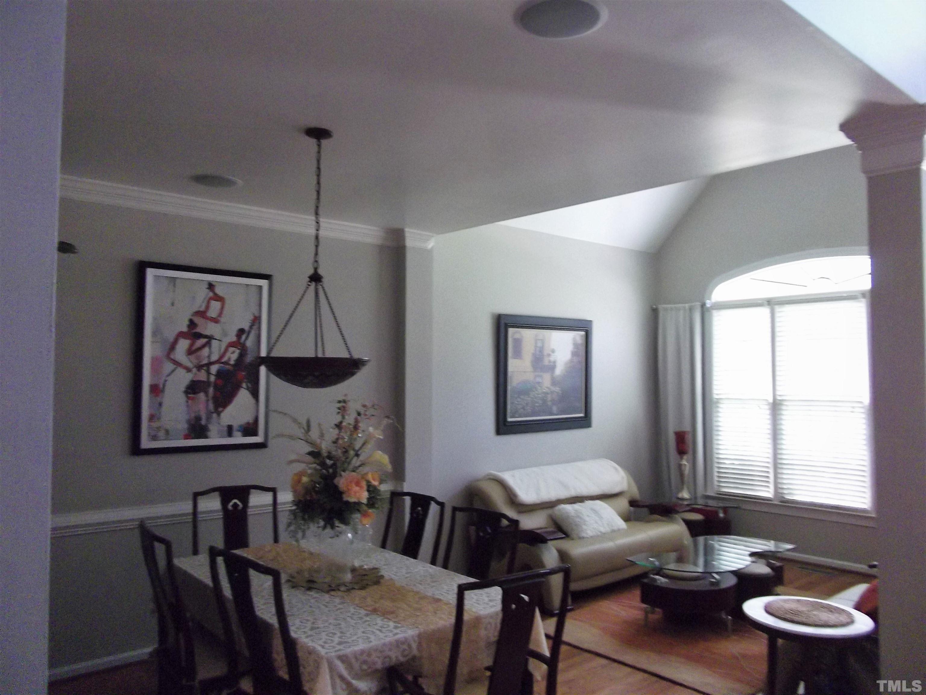 7912 Milltrace Run Raleigh, NC 27615 - Photo 8 of 36 a view of a dining room with furniture window and wooden floor