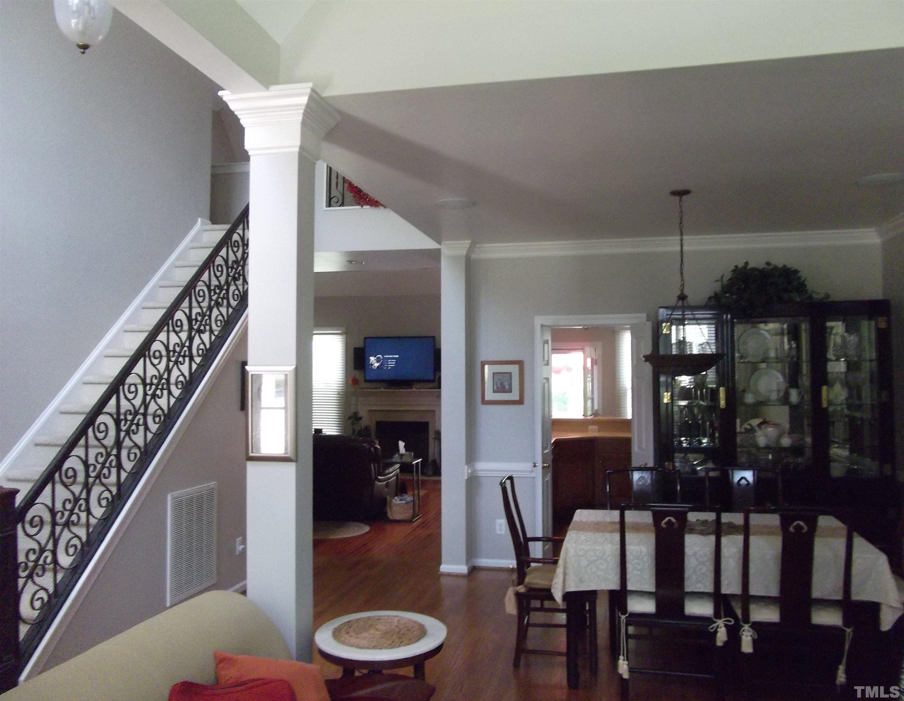 7912 Milltrace Run Raleigh, NC 27615 - Photo 10 of 36 a view of a dining room with furniture and wooden floor