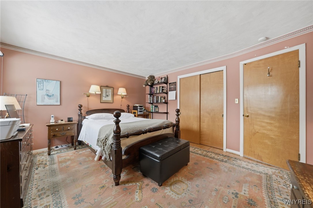 54 Coniston Road Amherst, NY 14226 - Photo 22 of 50 Primary bedroom with double closets & half bath ac