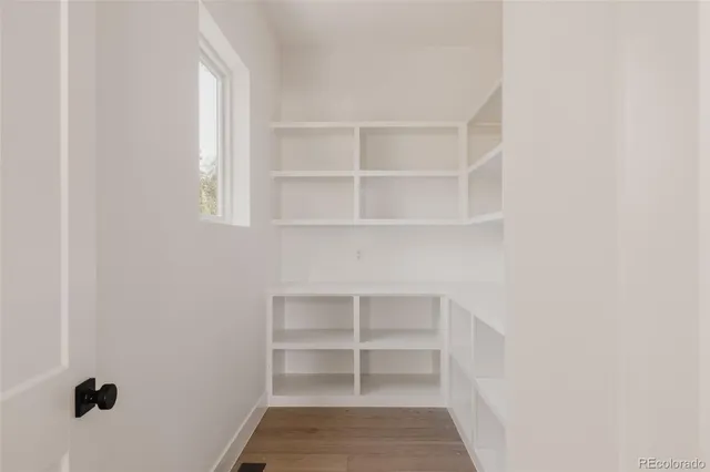 a view of a dining room with furniture and window