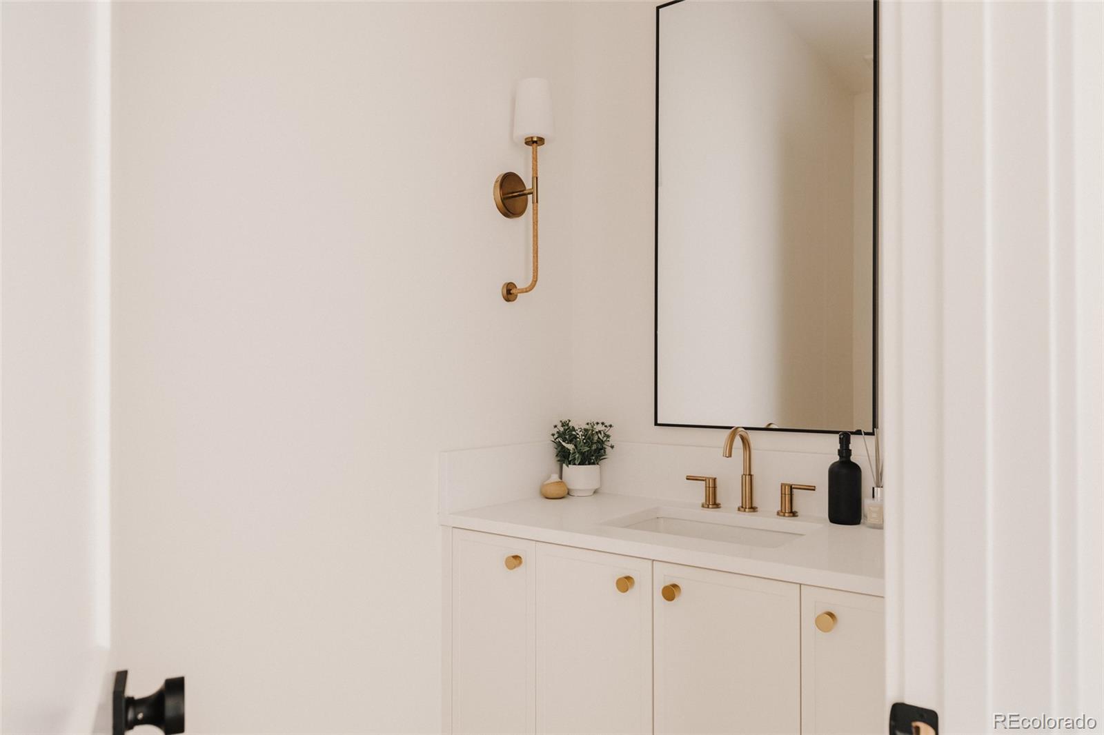 3530 Fenton Street Wheat Ridge, CO 80212 - Photo 17 of 44 a bathroom with a sink and a mirror
