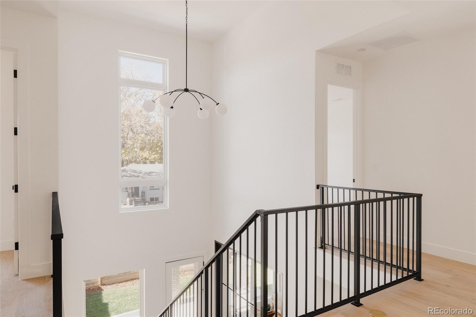 3530 Fenton Street Wheat Ridge, CO 80212 - Photo 18 of 44 a view of a hallway with windows