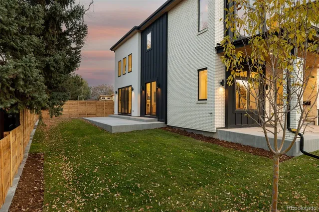 a spacious bathroom with a tub sink and mirror