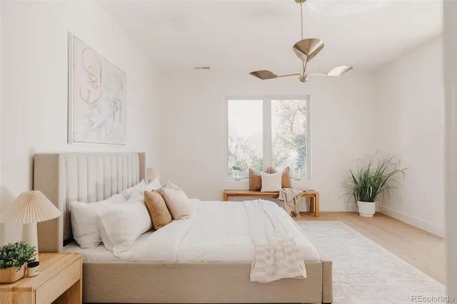 a bedroom with a bed and window