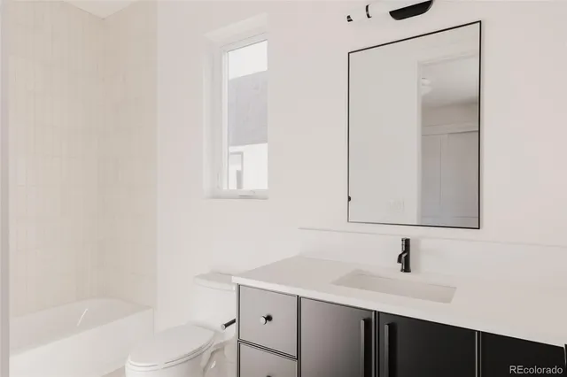 a view of a hallway with wooden shelves